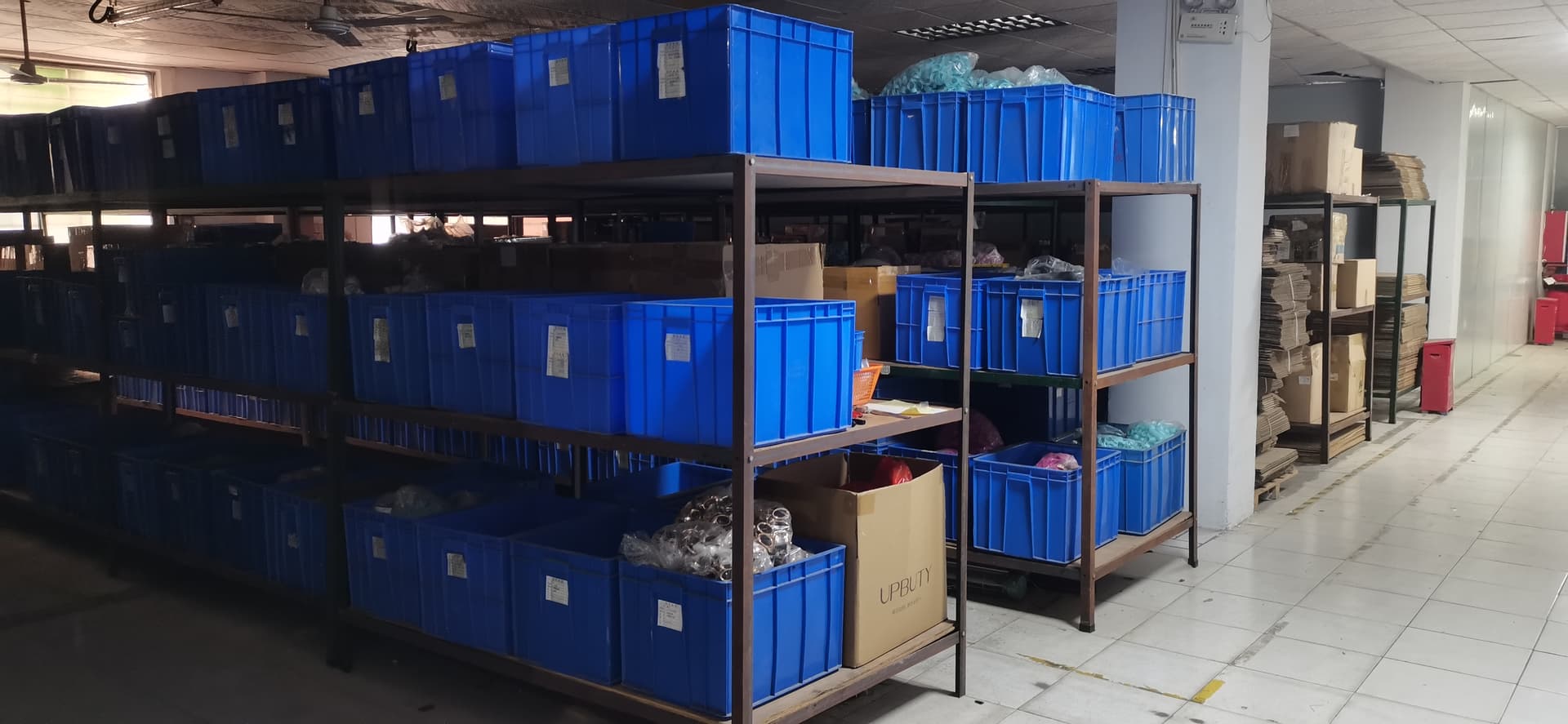 Evokomoribi main warehouse — blue bins and finished goods storage for bulk B2B orders